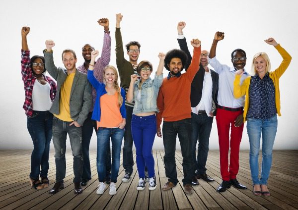 Happy group with arms raised