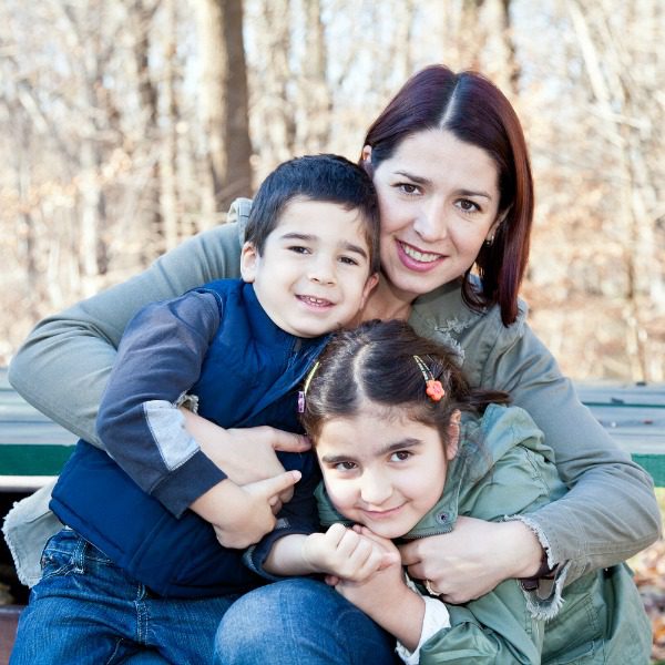 Mother and sons hugging